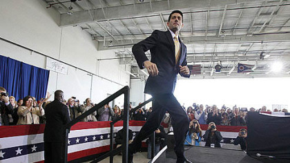 Republican vice presidential candidate Paul Ryan takes the stage Monday during a campaign rally in a Grand Aire hangar at Toledo Express Airport near Swanton, Ohio.