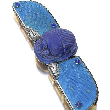 Cartier made this belt buckle around 1926 out of faience, enamel, sapphires, and diamonds.