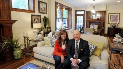 Mary and Mark Pent in their living room. A wall was removed between the old living room and the dining room visible in the background.