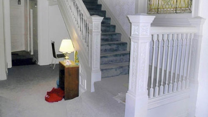 The oak staircase of Ty and Sue Ely's home in Shadyside was painted white when they bought it.