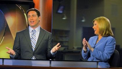 Todd McDermott, seen here in a 2011 photo, talks to a floor person, as WPXI co-anchor Jennifer Abney reacts.