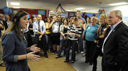 Hana Barkowitz, 16, of Mt. Lebanon, left, a volunteer and US Congressman Mike Doyle, far right, and Obama for America Pennsylvania staff open the newest field office Oct. 2 in Dormont.