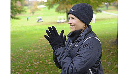 Lynda McCabe, John's mother, cheers for her son as he competes in a golf tournament Monday for North Allegheny High School at the Hiland Golf Course in Butler.