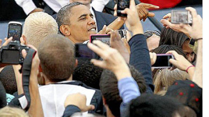 President Barack Obama greets supporters at the University of Iowa in Iowa City on Friday.