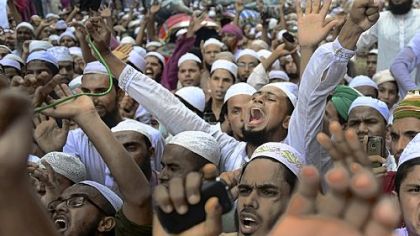 About 10,000 protesters in Bangladesh burned American and Israeli flags and tried to march to the U.S. Embassy in Dhaka on Friday to protest an anti-Islam film that has infuriated the Muslim world.