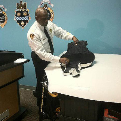 Pittsburgh Police Chief Nate Harper shows the bullet-resistant vest Officer Andrew Baker was wearing, and where the bullet struck: In the center of Officer Baker's chest.