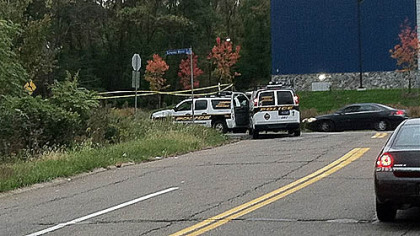 Police vehicles blocked off access to the area of the early morning shooting in Stanton Heights.
