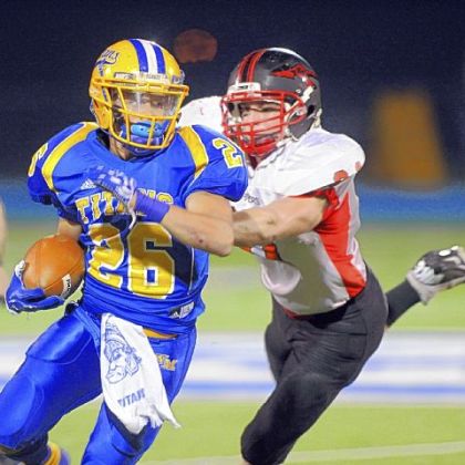West Mifflin running back Jimmy Wheeler rushes against Elizabeth Forward in the first quarter last Friday.
