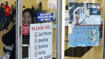 A poster at the PennDOT  driver's license center in Penn Hills, upper right, with the heading "Show It" wrongly states that one needs a photo ID to vote in the Nov. 6 election. The same poster hangs at a PennDOT center in Harrisburg.