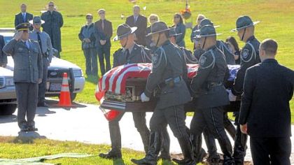 Troopers carry the casket of Trooper First Class Blake T. Coble to the graveside ceremony at St. Mary's Roman Catholic Church Cemetery in Beaver Falls.