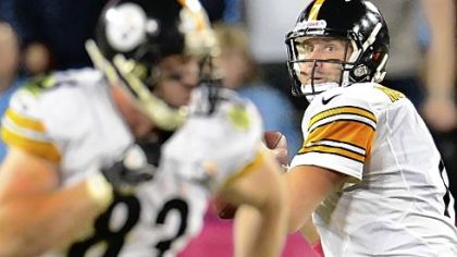 Quarterback Ben Roethlisberger looks to pass against the Titans, with Heath Miller in the foreground.