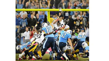Titans kicker Rob Bironas hits the winning field goal for Tennessee over the Steelers as time expires last night in Nashville.