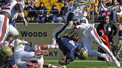Pitt's Rushel Shell flips into the end zone for a touchdown against Louisville in the second quarter at Heinz Field today.