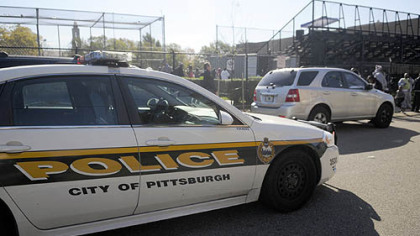 Pittsburgh police at the scene of a shooting before a peewee football game this morning adjacent to the Pittsburgh Obama International Studies Academy in East Liberty.