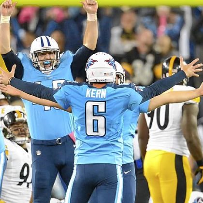 Titans holder Brett Kern (6) celebrates kicker Rob Bironas' winner Thursday against the Steelers in Nashville, Tenn.