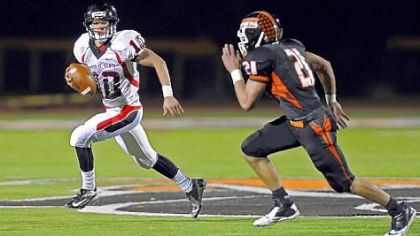 Upper St. Clair quarterback Pete Coughlin scrambles away from Bethel Park's Gary Gerst Friday night at Bethel Park.