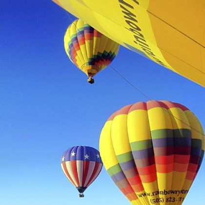 One by one, hot air balloons float into the sky over Albuquerque, N.M.