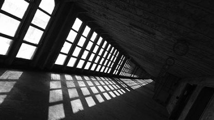 Floor to ceiling windows let in the afternoon light on the ship's enclosed promenade.