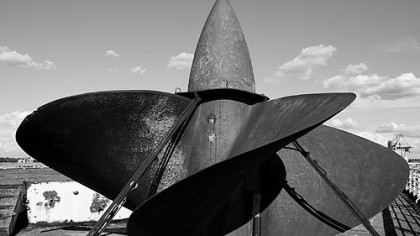 One of the ship's massive props -- a technical marvel of the time -- sits on the ship's deck.