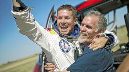 Felix Baumgartner, left, of Austria and technical project director Art Thompson celebrate after Mr. Baumgartner parachuted safely Sunday into the New Mexico desert about nine minutes after jumping from a capsule roughly 24 miles above Earth, breaking the sound barrier during his plunge.