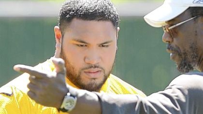 Steelers defensive lineman Alameda Ta'amu, left, with defensive line coach John Mitchell