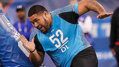 Alameda Ta'amu runs a drill at the NFL football scouting combine in February.