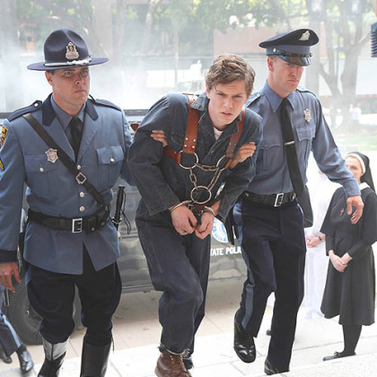 Evan Peters, center, portrays a man accused of being a serial killer and brought to Briarcliff, an insane asylum, in the second season of FX's "American Horror Story."