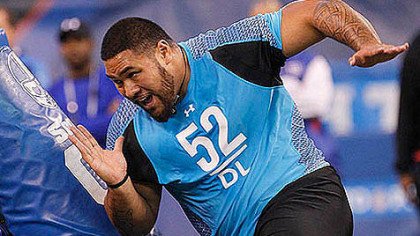 Alameda Ta'amu runs a drill at the NFL scouting combine in February.
