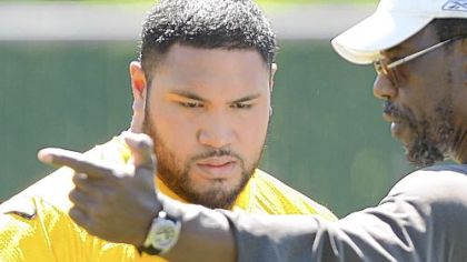 Steelers defensive lineman Alameda Ta'amu, left, with defensive line coach John Mitchell