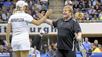 Tennis great Martina Navratilova and Sir Elton John celebrate a win during the Mylan WTT Smash Hits World Team Tennis Match at the Petersen Events Center Tuesday night. The event raised $1 million for the first time in its 20-year history.