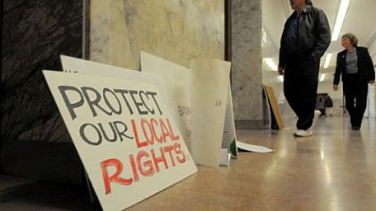 Protest signs litter the hallway Wednesday outside the state Supreme Court hearing into challenges against Pennsylvania's Marcellus Shale drilling law.