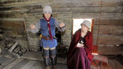 Nathan Baker, 12, and his sister, Jessica Baker, 16, portray young people during the Revolutionary War period inside the Bloody Dirt Tavern at the Enoch Wright House in Peters.