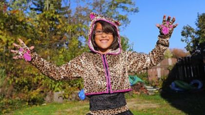 Harmony Ziccardi, 8, shows of her leopard girl Halloween costume outside her home in Pleasant Hills on Tuesday.