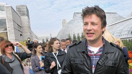 Chef Jamie Oliver greets guests Thursday after finishing speaking about his Food Revolution and Pittsburgh's plans to participate in the program at Phipps Conservatory's edible rooftop garden.