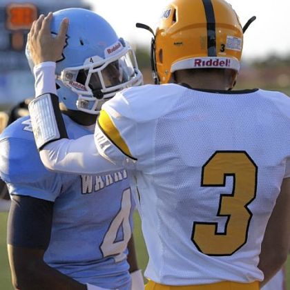 Montour receiver Devin Wilson, right, greets Central Valley receiver Robert Foster before the start of their game earlier this season.