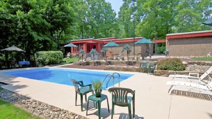 The 2.29-acre property at Merrie Woode Drive includes two large pressure-treated wood decks near the 10-foot deep concrete pool. The 36- by 14-foot pool was repainted last year.
