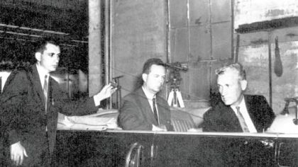 In the re-enactment of the Kennedy assassination, with stand-ins in a replica of the president?s limousine, Arlen Specter demonstrates the bullet?s path through the president?s neck and into Gov. John Connally?s back.
