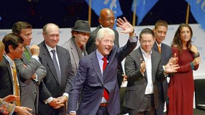 Former President Bill Clinton waves farewell to the crowd Thursday during the opening ceremony for the One Young World Summit at Heinz Hall, Downtown. Mr. Clinton gave an address and also hosted a question-and-answer session with the conference attendees.