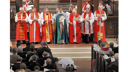 Bishop Dorsey W.M. McConnell prostrates himself during his ordination at Calvary Episcopal Church in Shadyside Saturday.