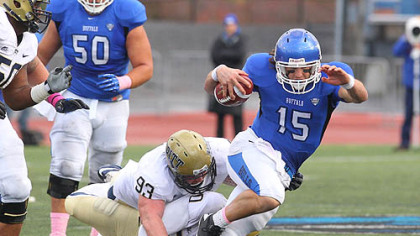 Pitt's Bryan Murphy, top, and T.J. Clemmings trip up Buffalo's Alex Zordich in the first half Saturday in the Panthers' non-conference win in Amherst, N.Y.