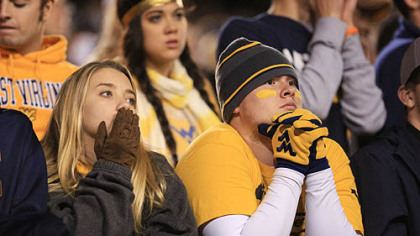 West Virginia fans watch from the stands during the second half.