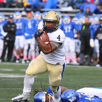 Pitt's Rushel Shell breaks away from Buffalo's Khalil Mack to score a touchdown during the first half.