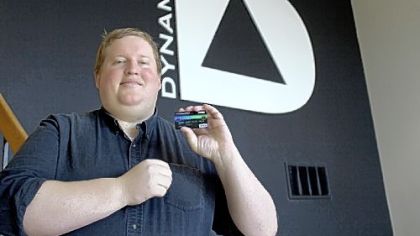 Jeff Mullen, CEO of Dynamics Inc., holds the new ePlate Visa card.
