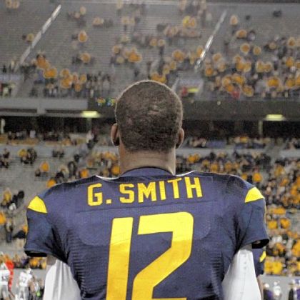 Coach Dana Holgorsen says quarterback Geno Smith is the last person to blame for West Virginia's struggles.