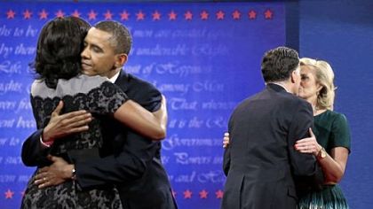 First Lady Michelle Obama, left, hugs President Barack Obama as Ann Romney, right, hugs Republican presidential candidate Mitt Romney at the end of the third and final presidential debate Monday at Lynn University in Boca Raton, Fla.