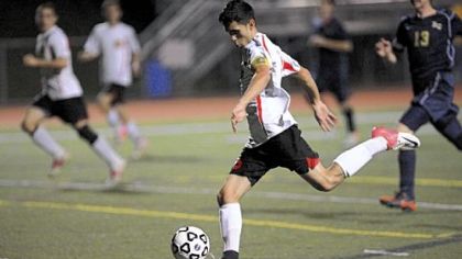 Serra's Josh Lohr gets off a shot on goal during the Eagles first-round playoff victory against Beth-Center Monday at Peters Township.