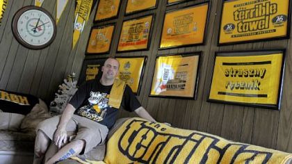 Bryan Wassel with his large collection of Terrible Towels, in his Irwin home.