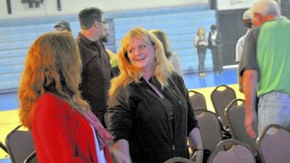 Emily McCowan, center, of Jefferson Hills talks during the "meet and greet" session of Exalt Church services, held at Wilson Christian Academy.