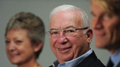 'Client service is the most important thing we do here,' says Harvey Pollack, center.