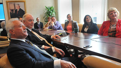 Chris George, left, senior vice president at Hefren-Tillotson, and Jim Meredith, executive vice president, attend a compliance training session.